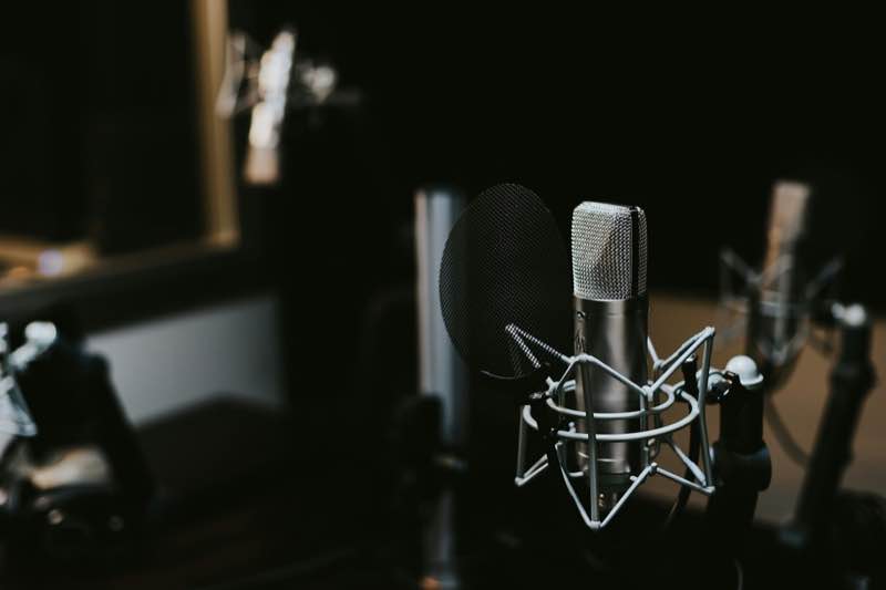 A microphone in a dark studio