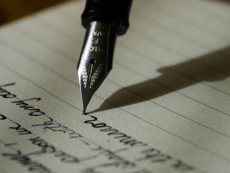A fountain pen on lined paper
